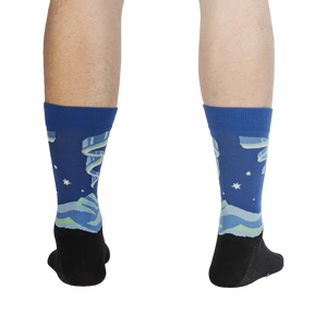 Rear view of a pair of Northern Lights socks on a person's legs, highlighting the full design and color scheme.
