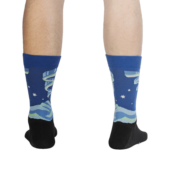 Rear view of a pair of Northern Lights socks on a person's legs, highlighting the full design and color scheme.