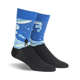 blue crew socks with aurora borealis, mountains, and person imagery. mens sizes.  