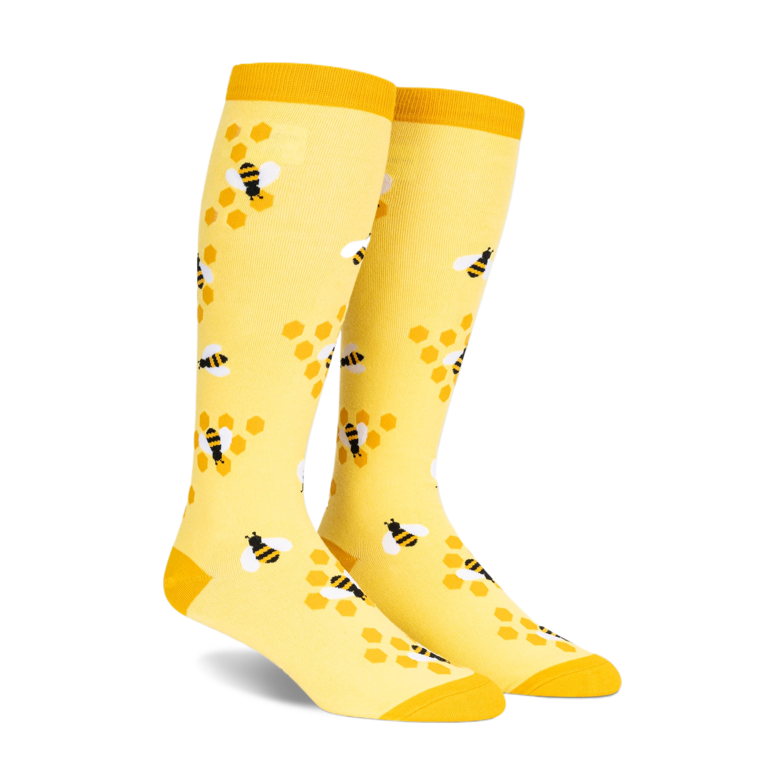 Pair of yellow knee-high socks with a pattern of black and white bees on honeycombs. 