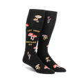 Pair of black knee-high socks with a whimsical design. Features various illustrated mushrooms and the text 'Let That Shiitake Go'.