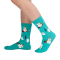 Lifestyle shot showing the teal 'Having Snow Much Fun' socks on a person's legs.