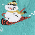 Close-up detail of the 'Having Snow Much Fun' socks, highlighting the intricate snowman design.