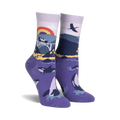Pair of purple crew socks with a Big Sur-inspired design.  Features whales, a bridge, a rainbow, and coastal mountains.
