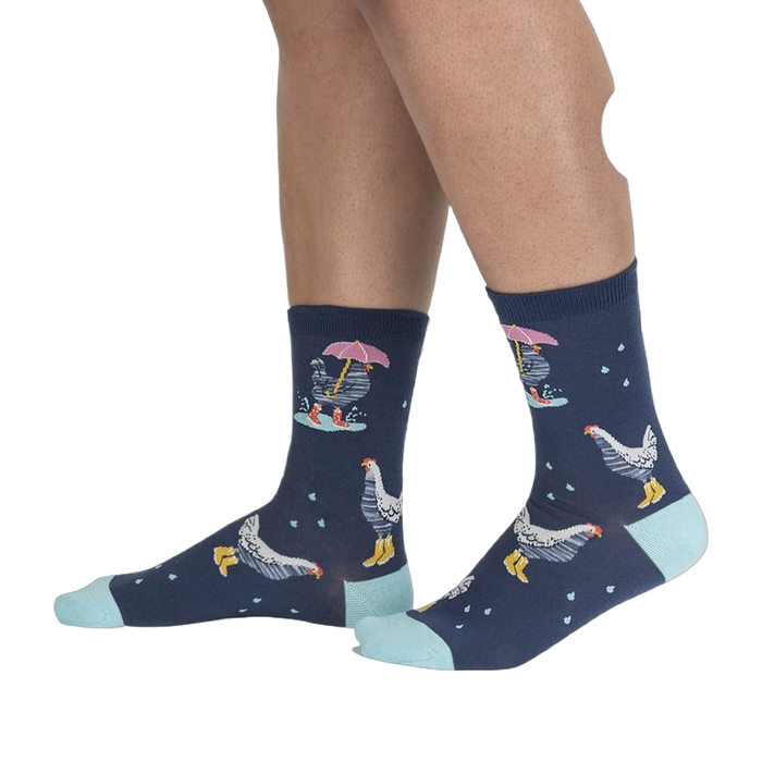 Lifestyle shot of a person's legs wearing the Chicken Little socks, highlighting the fit and pattern.