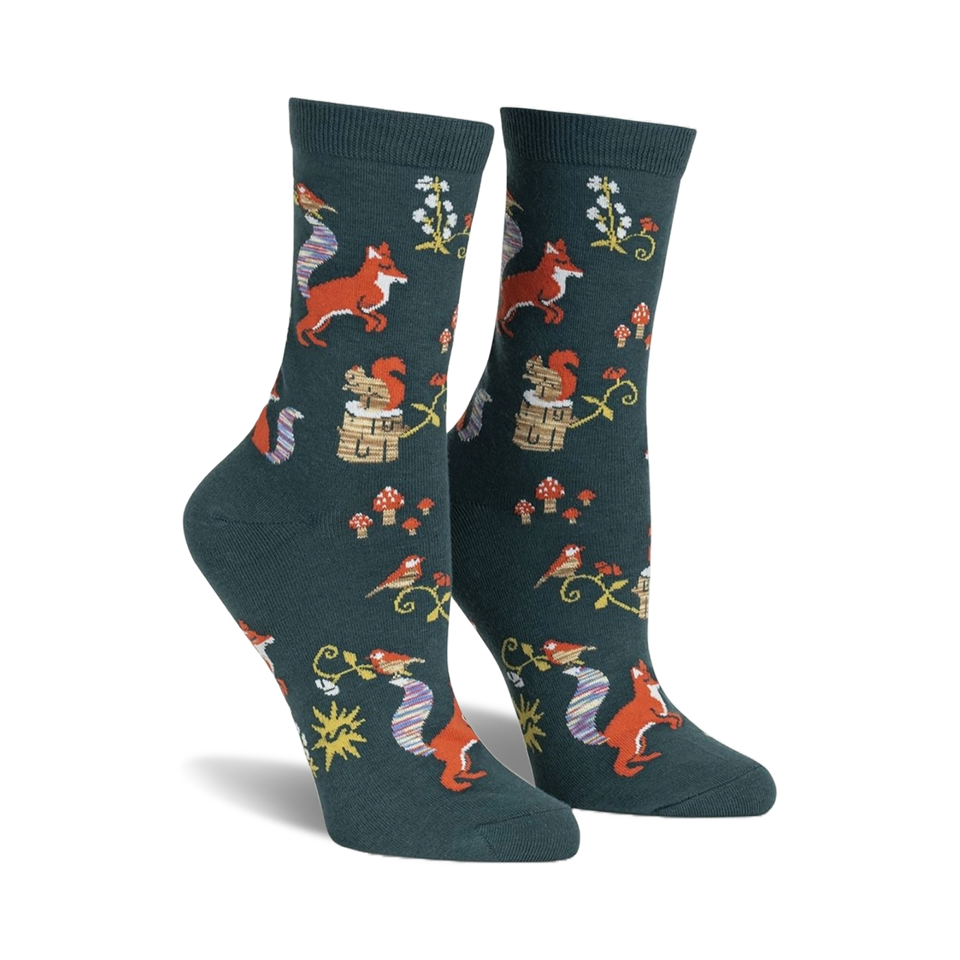 Pair of women's crew socks. Dark teal background with repeating pattern of foxes, squirrels, birds, mushrooms, and flowers. 