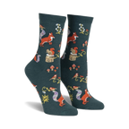 Pair of women's crew socks. Dark teal background with repeating pattern of foxes, squirrels, birds, mushrooms, and flowers. 