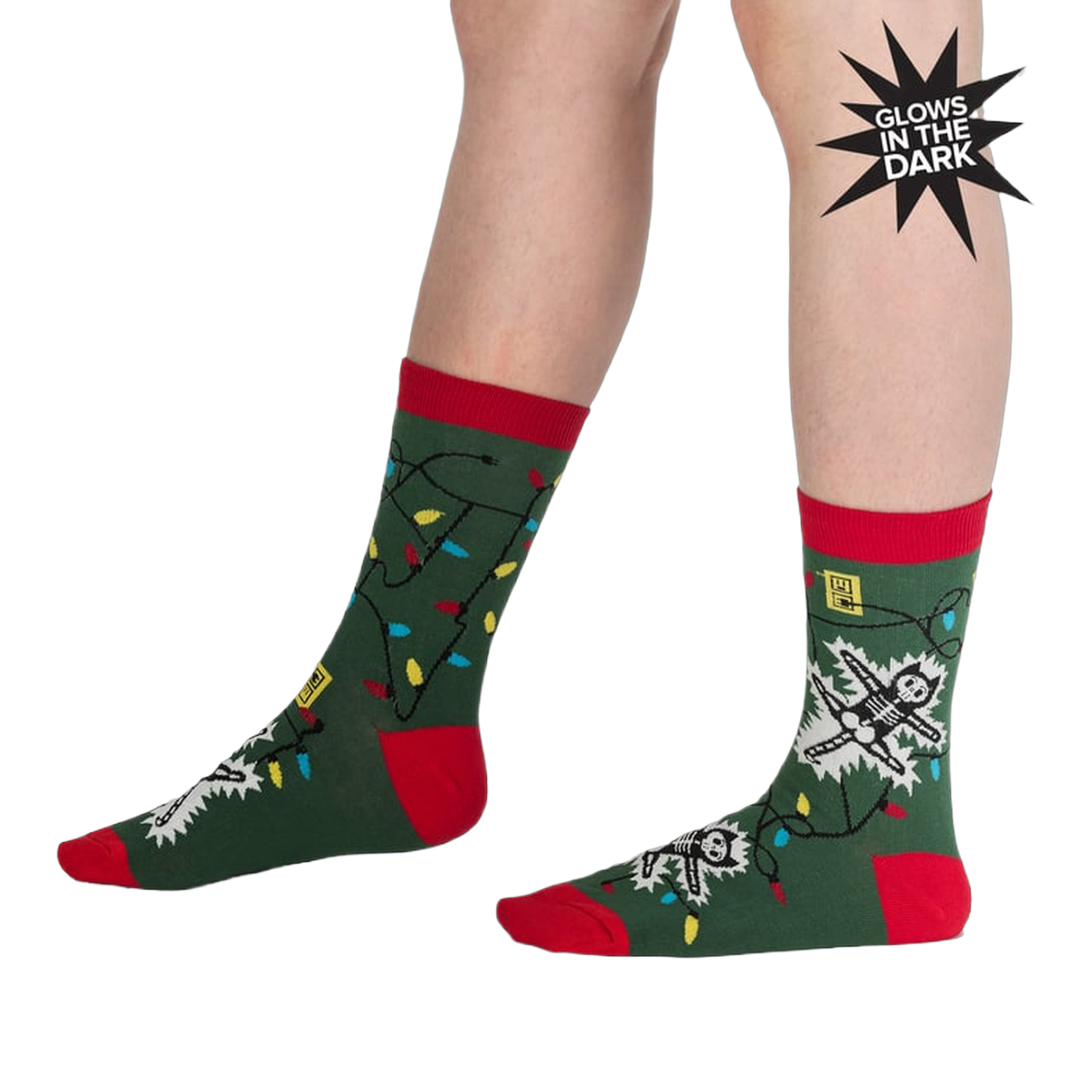 Lifestyle shot of a person modeling the 'Eating Light' socks, showcasing the glow-in-the-dark feature.