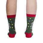 Back view of the 'Eating Light' socks on a model's legs, showing the full design.