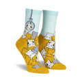 A pair of women's crew socks in mustard yellow and light blue. The socks feature a fun design of many cute cartoon cats appearing to be in a claw machine.