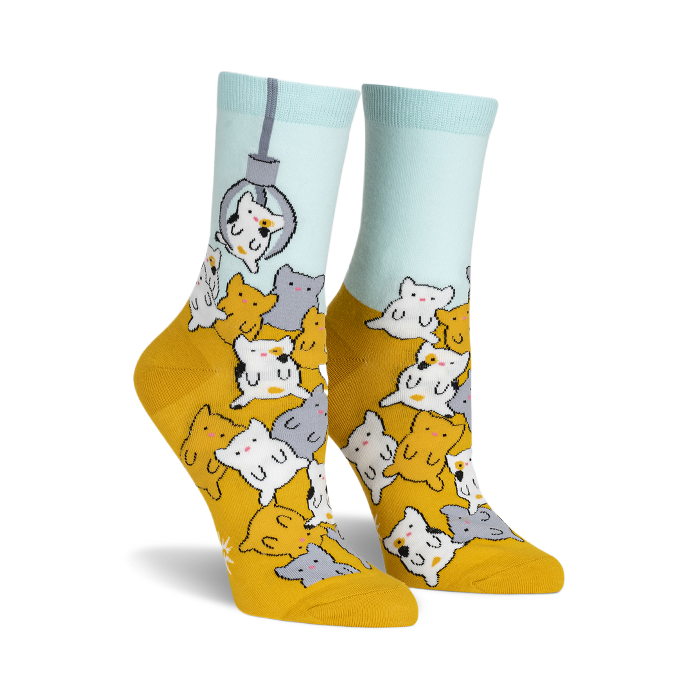 A pair of women's crew socks in mustard yellow and light blue. The socks feature a fun design of many cute cartoon cats appearing to be in a claw machine.