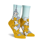 A pair of women's crew socks in mustard yellow and light blue. The socks feature a fun design of many cute cartoon cats appearing to be in a claw machine.