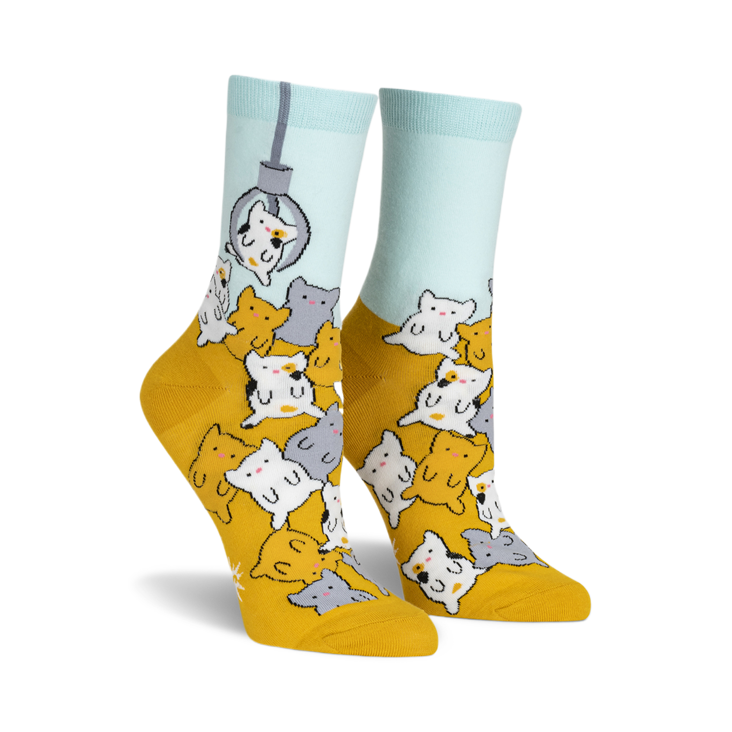 A pair of women's crew socks in mustard yellow and light blue. The socks feature a fun design of many cute cartoon cats appearing to be in a claw machine.