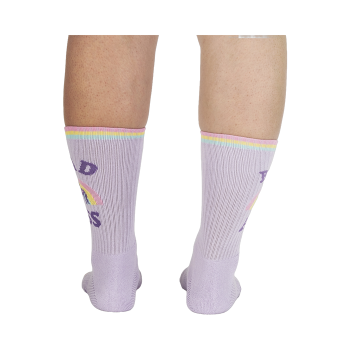 Rear view of the socks on a person's legs, showing the back design.