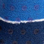 Close-up texture shot of the fuzzy blue and darker blue sock fabric with gripper dots.