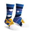 Pair of blue and yellow fuzzy slipper socks with a sun and moon design.  Horizontal stripes and smiley faces.