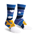 Pair of blue and yellow fuzzy slipper socks with a sun and moon design.  Horizontal stripes and smiley faces.