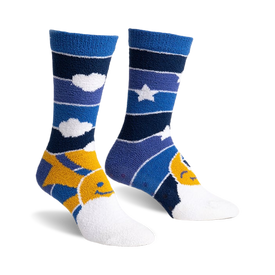 a pair of socks with a blue, purple and yellow striped pattern. the sock on the left side of the image has a yellow sun with a smiley face and white clouds on it. the sock on the right side of the image has a yellow crescent moon with a smiley face and a white star on it. the socks are laid out flat on a white background.  front view of the socks.