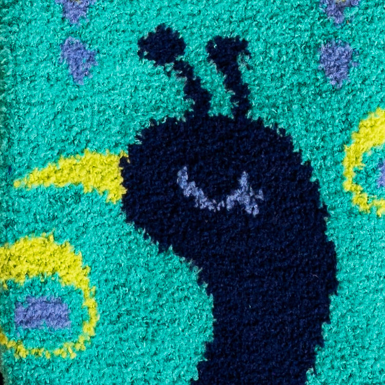 Detailed close-up of the peacock's face on the fuzzy slipper socks. 