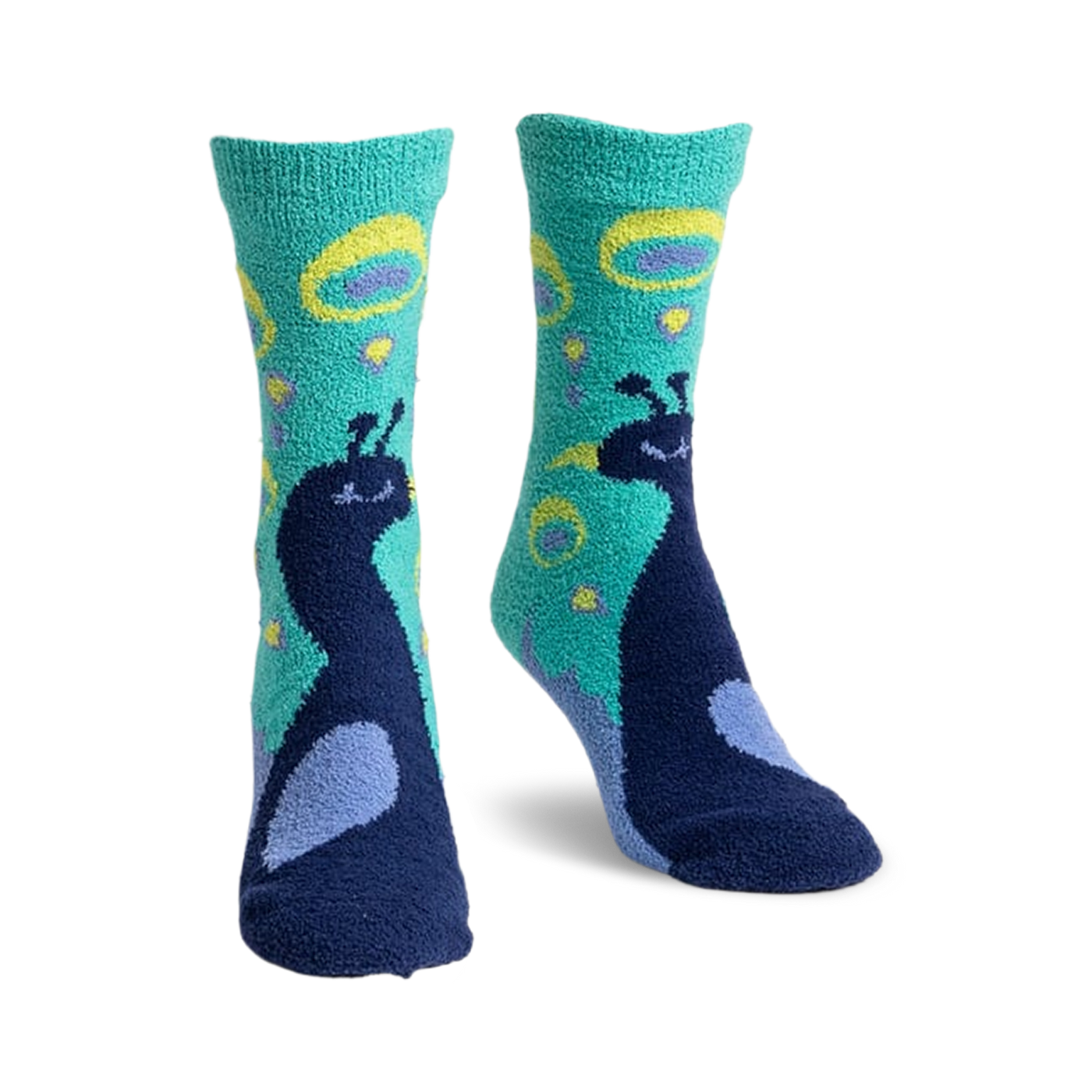 Pair of teal and navy blue fuzzy slipper socks with a whimsical peacock design.  Peacocks are detailed and surrounded by teal and yellow circles.