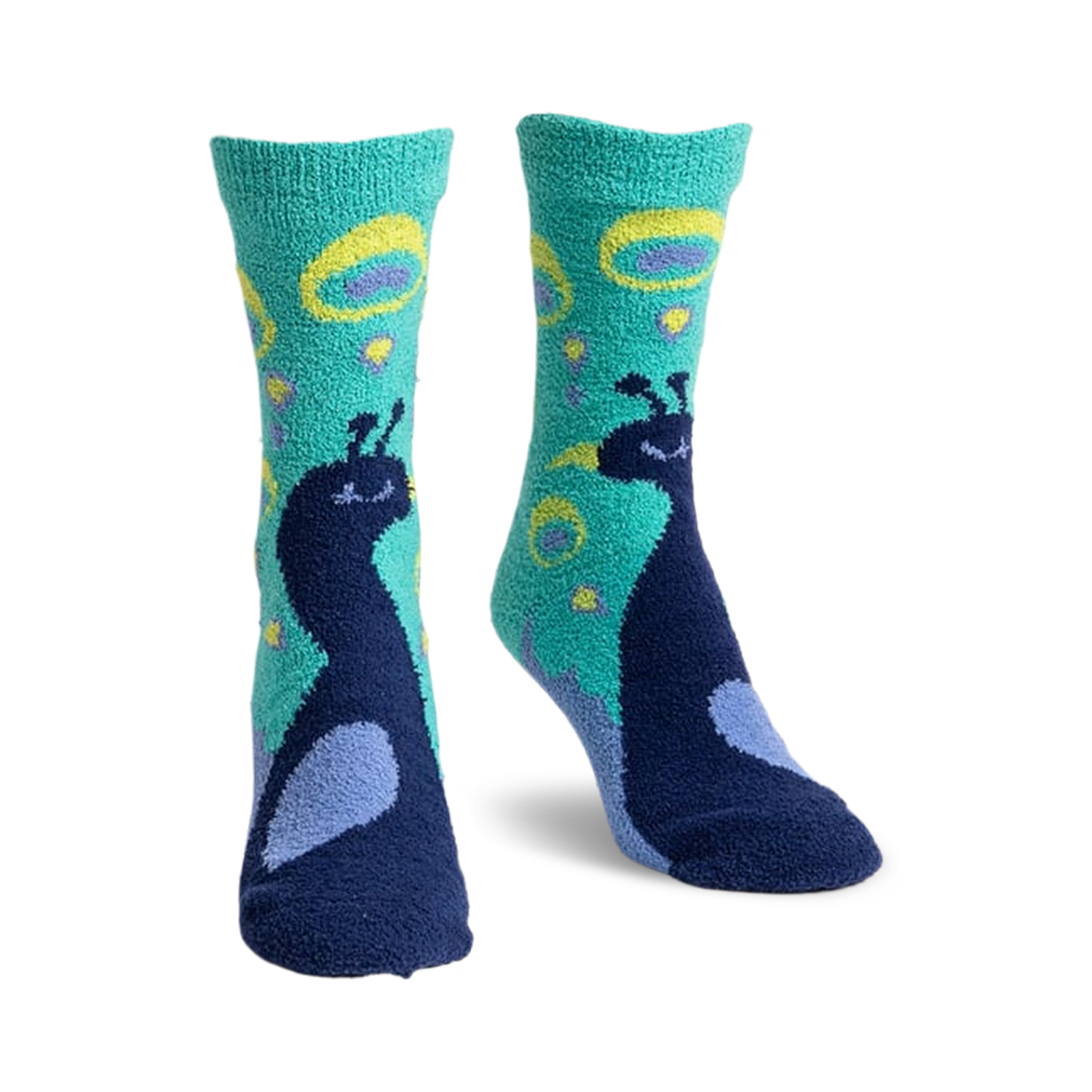 Pair of teal and navy blue fuzzy slipper socks with a whimsical peacock design.  Peacocks are detailed and surrounded by teal and yellow circles.