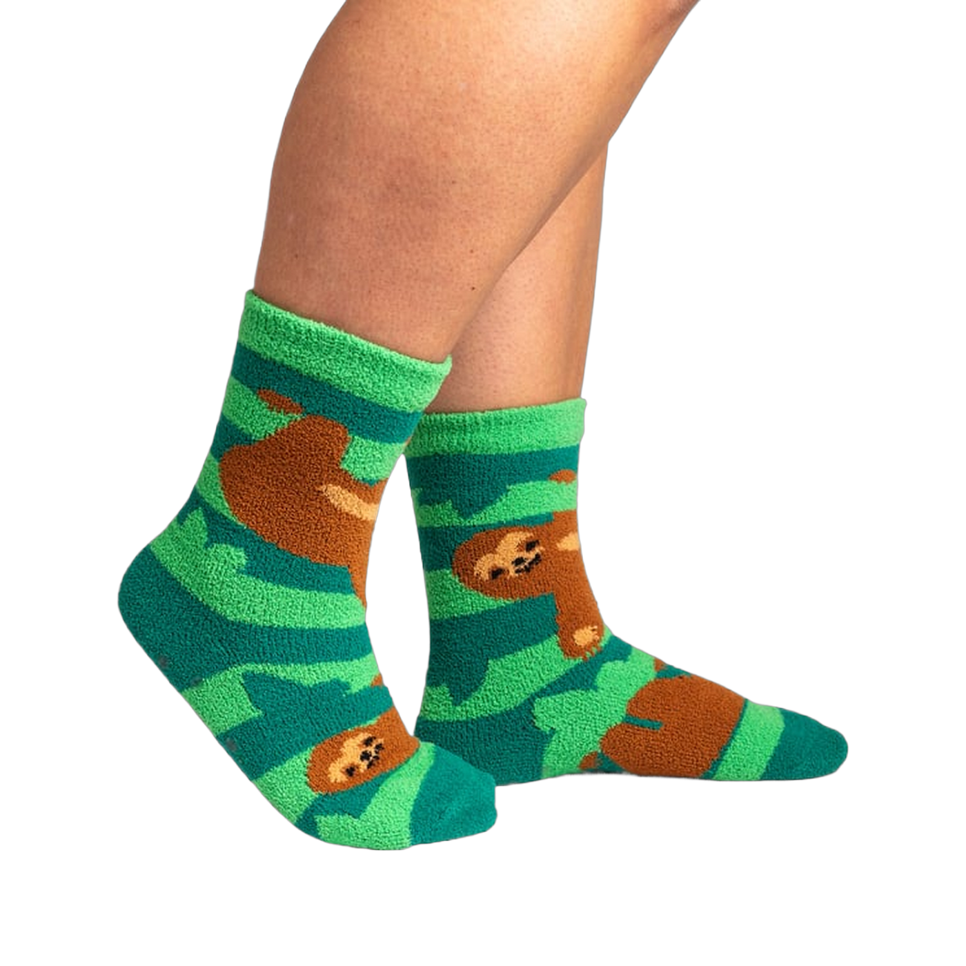 Lifestyle photo showing the socks on a person's feet.  The socks are teal and green with brown sloths.