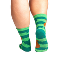 Back view of the socks showing grippers on the bottom. The socks are teal and green with brown sloths.