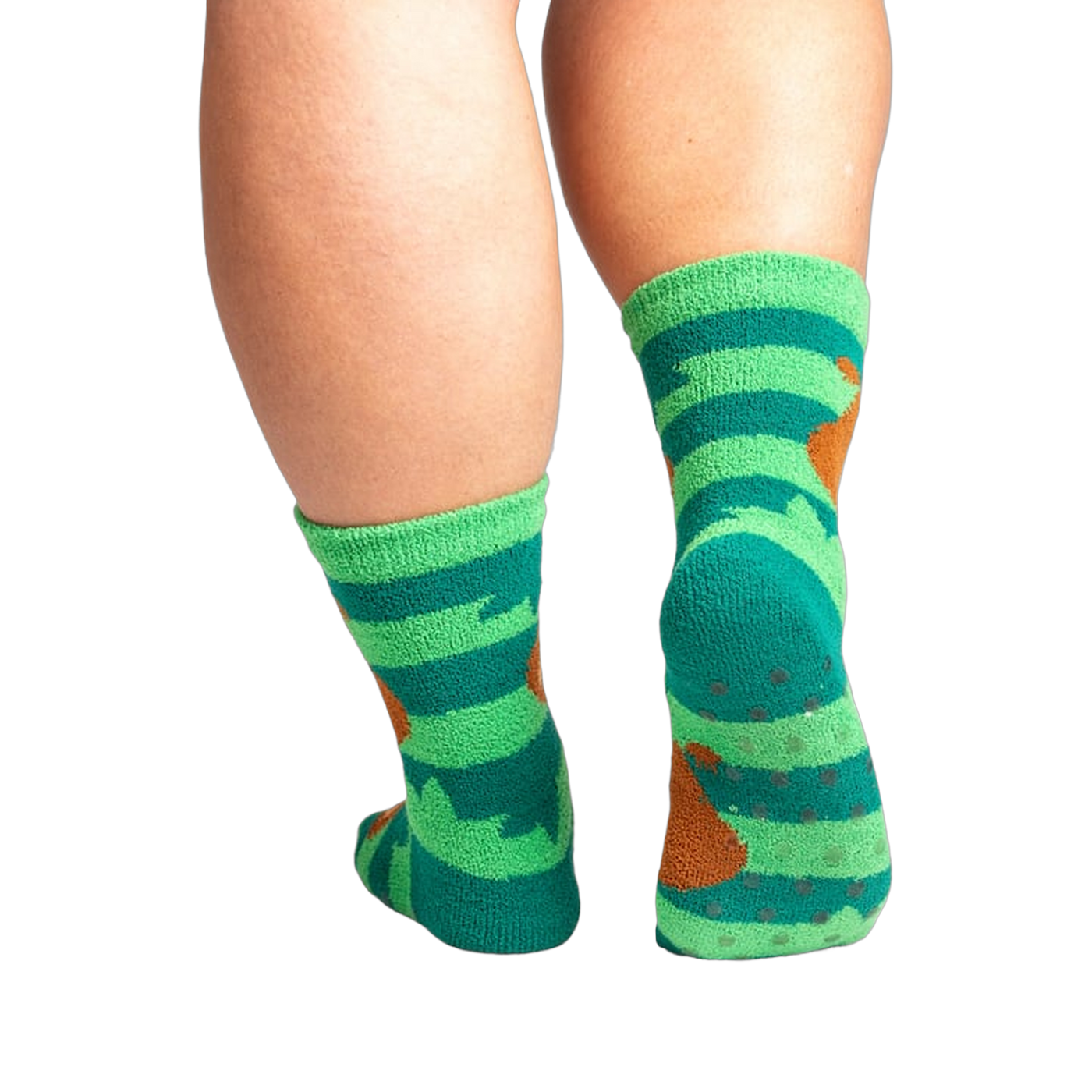 Back view of the socks showing grippers on the bottom. The socks are teal and green with brown sloths.
