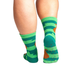 Back view of the socks showing grippers on the bottom. The socks are teal and green with brown sloths.