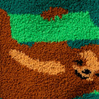 Close-up detail shot of the fuzzy sock texture and a brown sloth design.