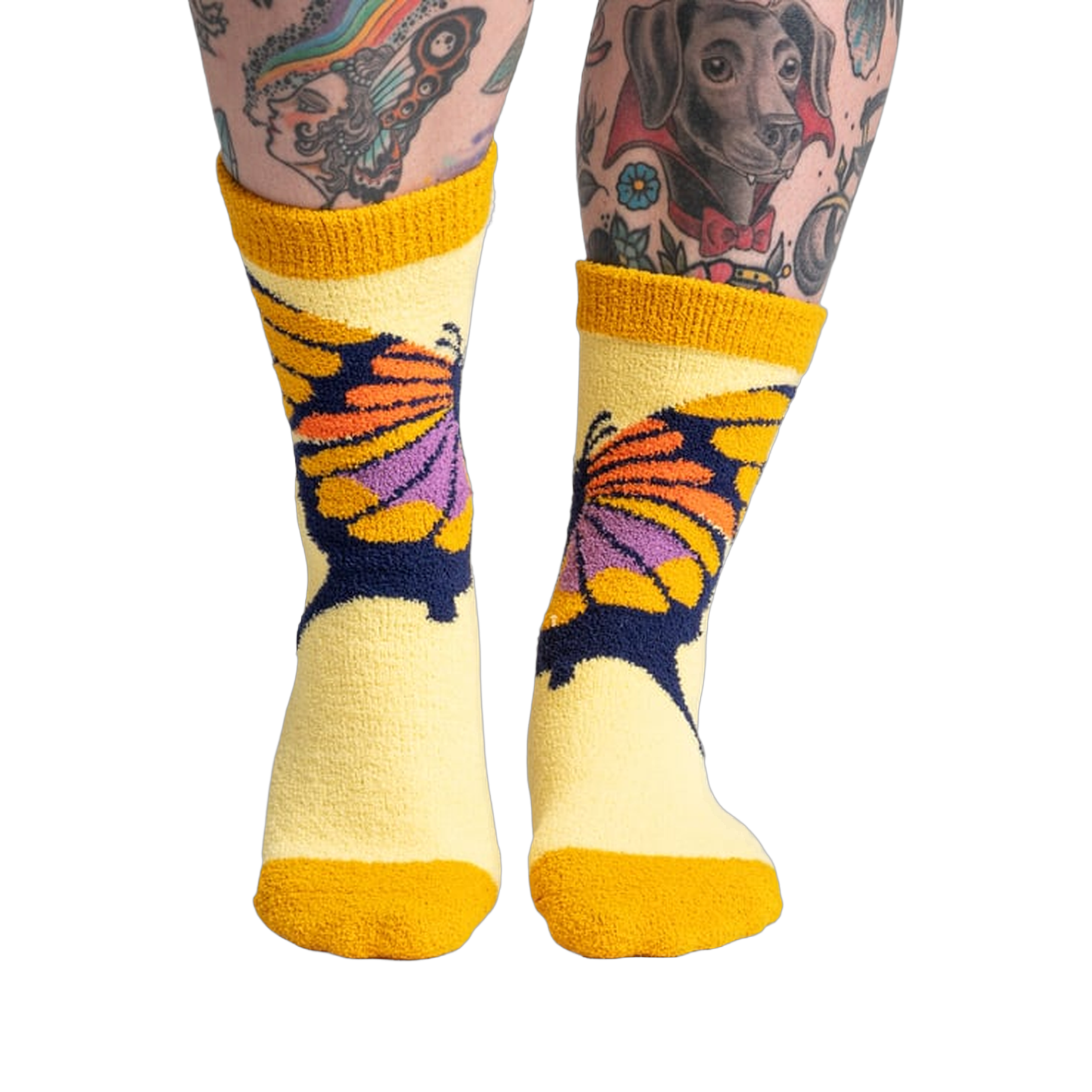 Lifestyle shot of a person wearing the yellow butterfly slipper socks, showcasing the fit and feel.