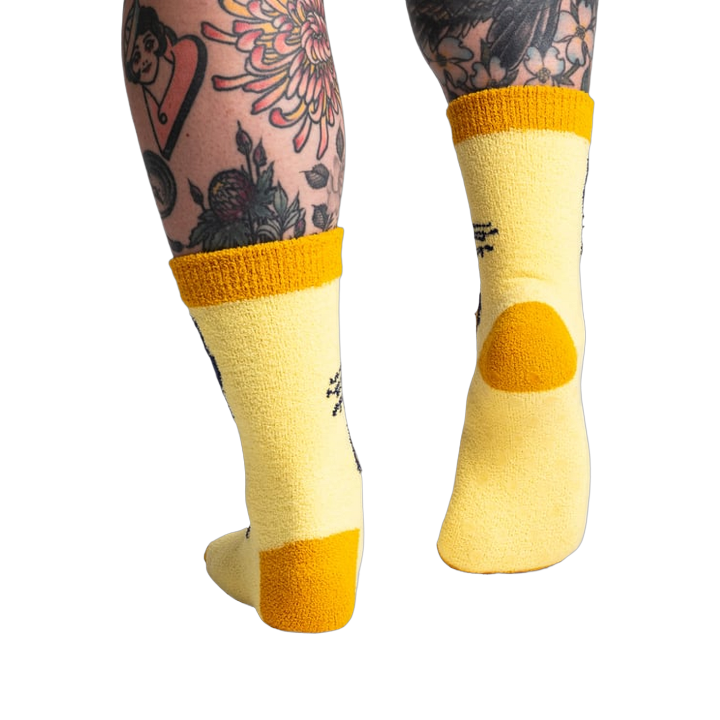 Back view of the yellow butterfly socks; highlighting the mustard yellow cuff and heel.