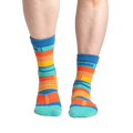 Lifestyle shot showing the socks on a person's feet, showcasing fit and style.