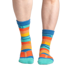 Lifestyle shot showing the socks on a person's feet, showcasing fit and style.