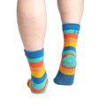 Back view of the socks on feet, highlighting the grippy bottom.
