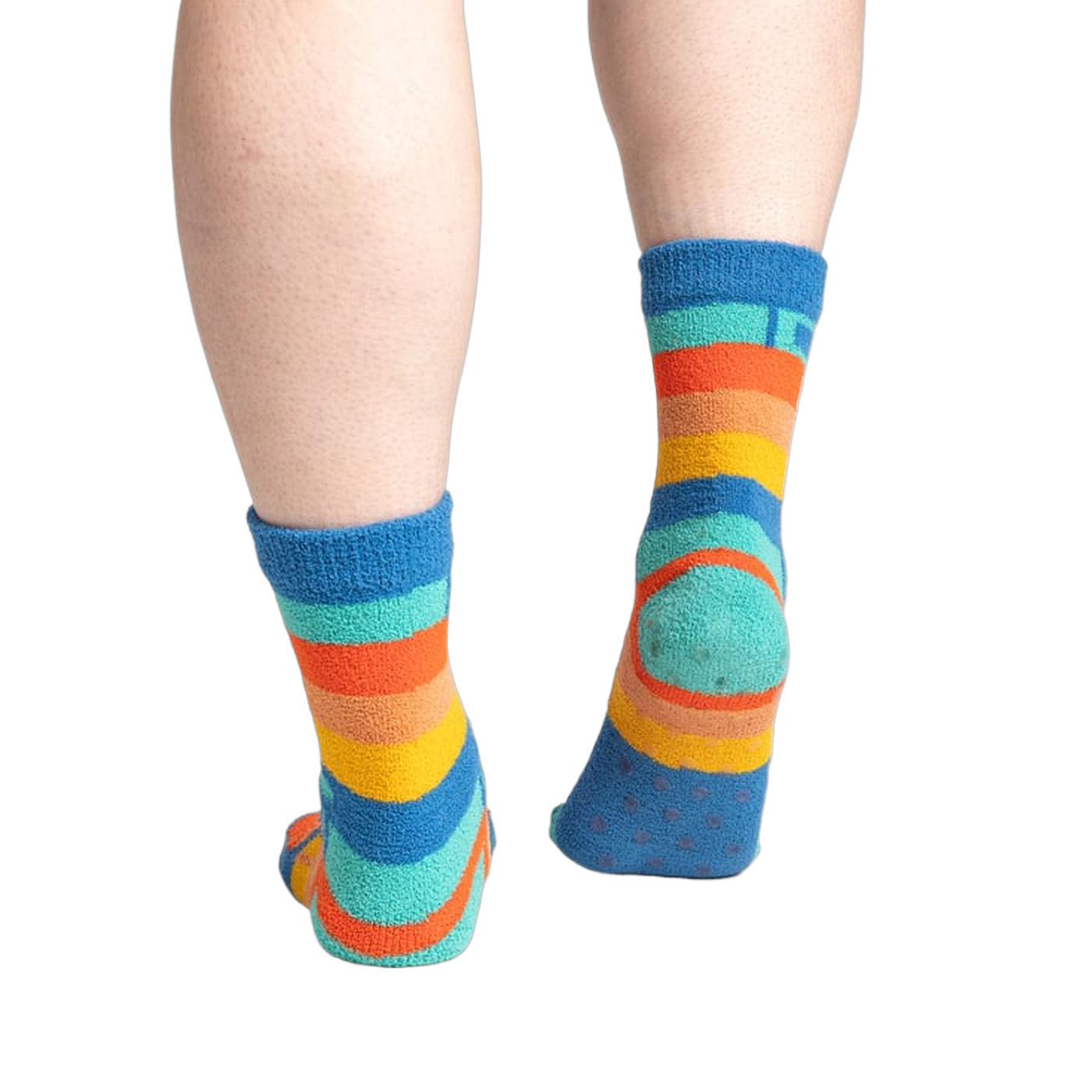 Back view of the socks on feet, highlighting the grippy bottom.