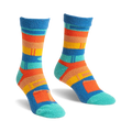 Pair of blue, orange, and teal striped slipper socks with a book design.  Fuzzy, comfy texture.
