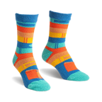 Pair of blue, orange, and teal striped slipper socks with a book design.  Fuzzy, comfy texture.