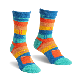 a pair of socks with blue, orange, yellow, and green stripes. the socks are fuzzy.  the photo shows a front view of the socks.