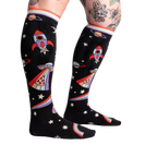 Close-up of 'You Are Outta This World' knee-high socks on a model's legs, showcasing the design.