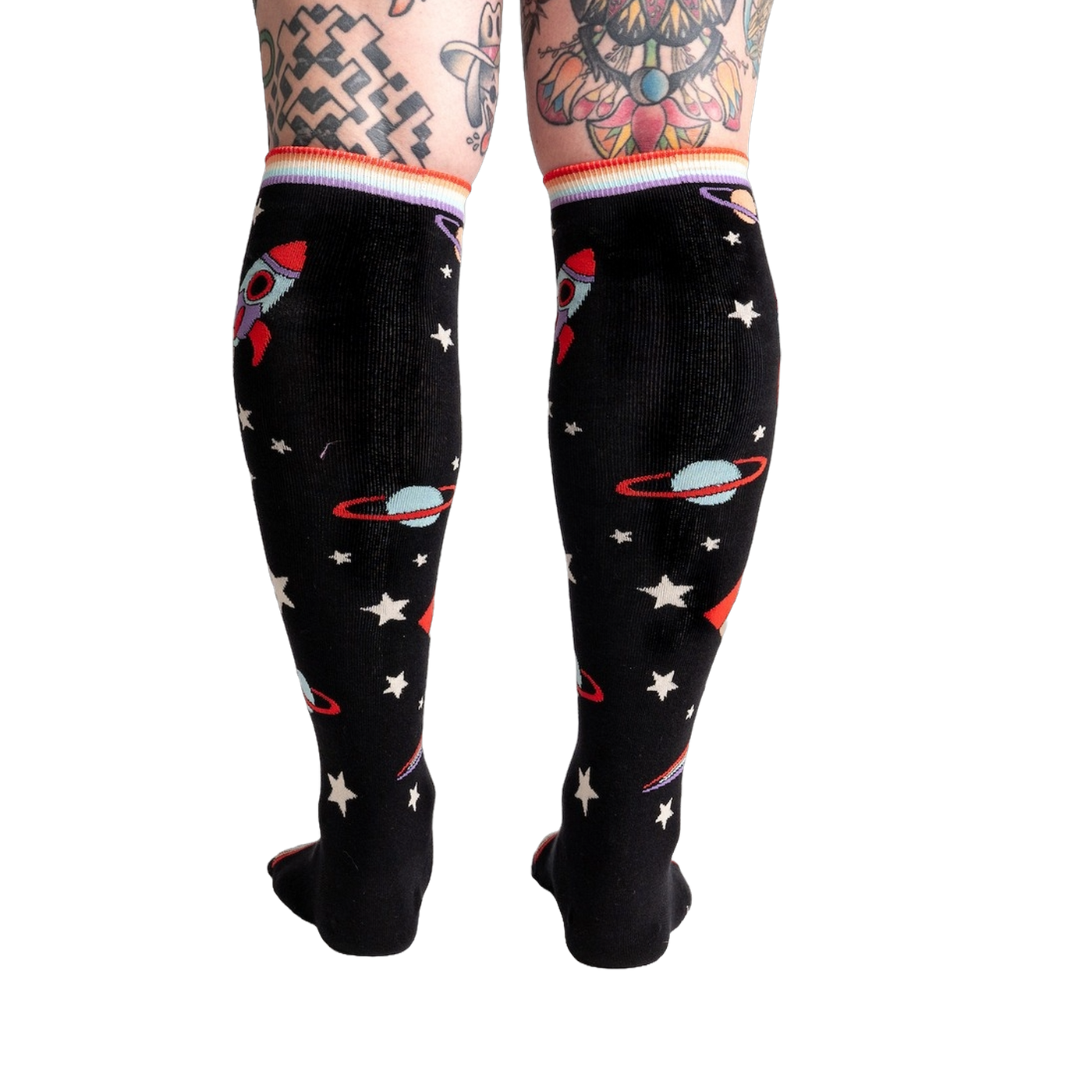 Back view of the socks on a model's legs, showing the full sock pattern.