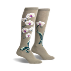 Pair of women's knee-high socks in sage green with a design of white orchids and dark green leaves.