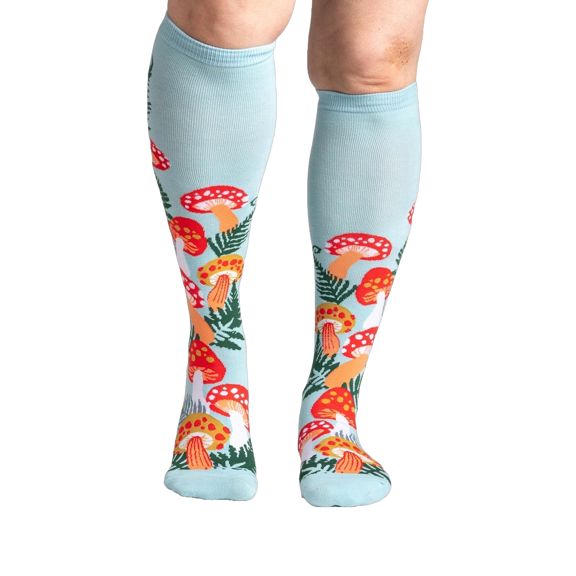 Lifestyle shot showcasing the Wonderland Mushrooms knee-high socks on a model's legs.