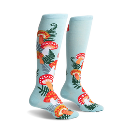 light blue knee-high socks with all-over pattern of red and orange mushrooms, white spots, green ferns.  