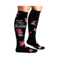 Lifestyle shot: Woman's legs wearing black knee-high socks with red roses and a phrase.