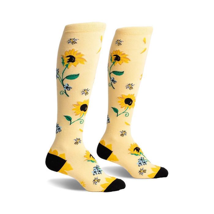 womens vibrant sunflower, bee, and blue flower knee-high socks with black toe and heel.  