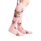 Lifestyle shot showcasing 'Fawn'd of You' knee-high socks on a model's legs, highlighting the sock's fit and pattern.