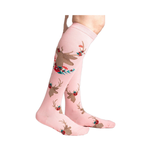 Lifestyle shot showcasing 'Fawn'd of You' knee-high socks on a model's legs, highlighting the sock's fit and pattern.