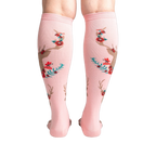 Back view of 'Fawn'd of You' knee-high socks, showing the full floral and deer design on a pink background.