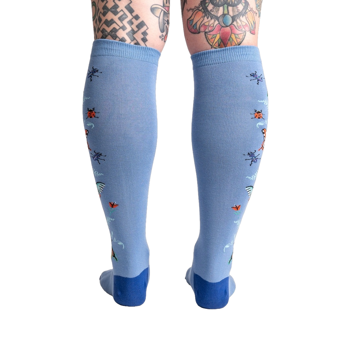 Back view of the light blue knee-high socks showcasing the full design featuring butterflies and ladybugs.